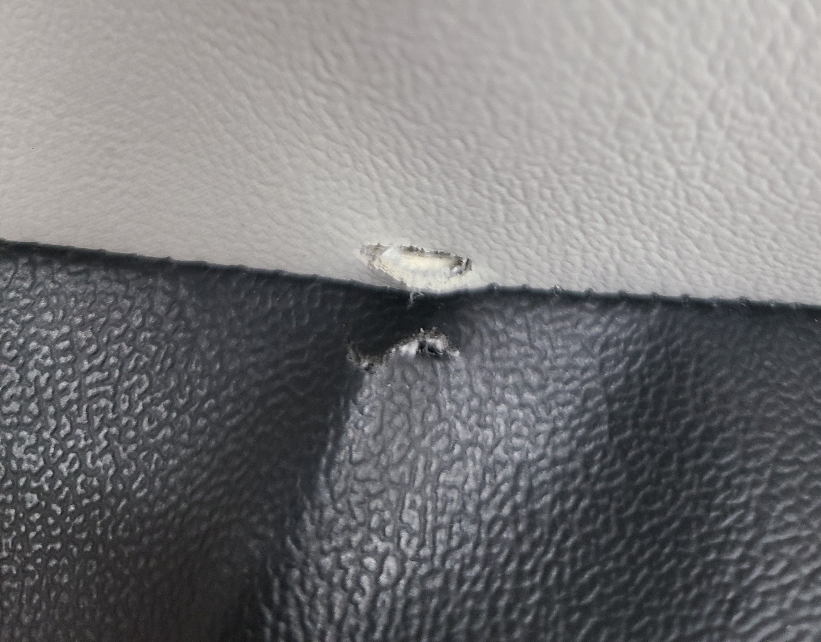 Rip in Side Cushion Close Up.jpg